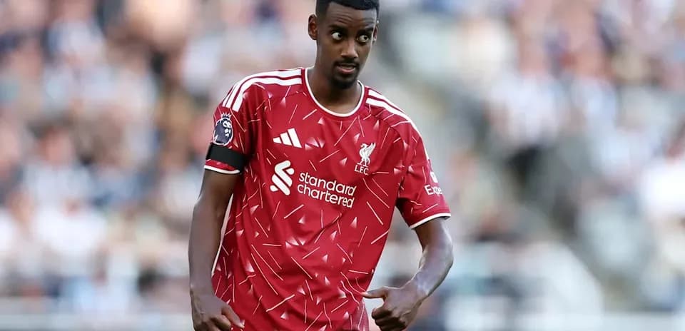 Player in Liverpool kit gestures during match