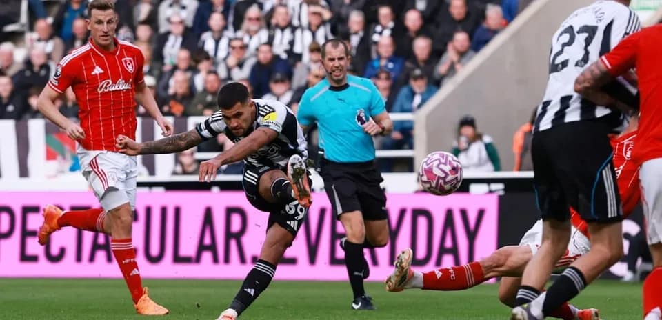 Newcastle player shoots during Nottingham Forest match
