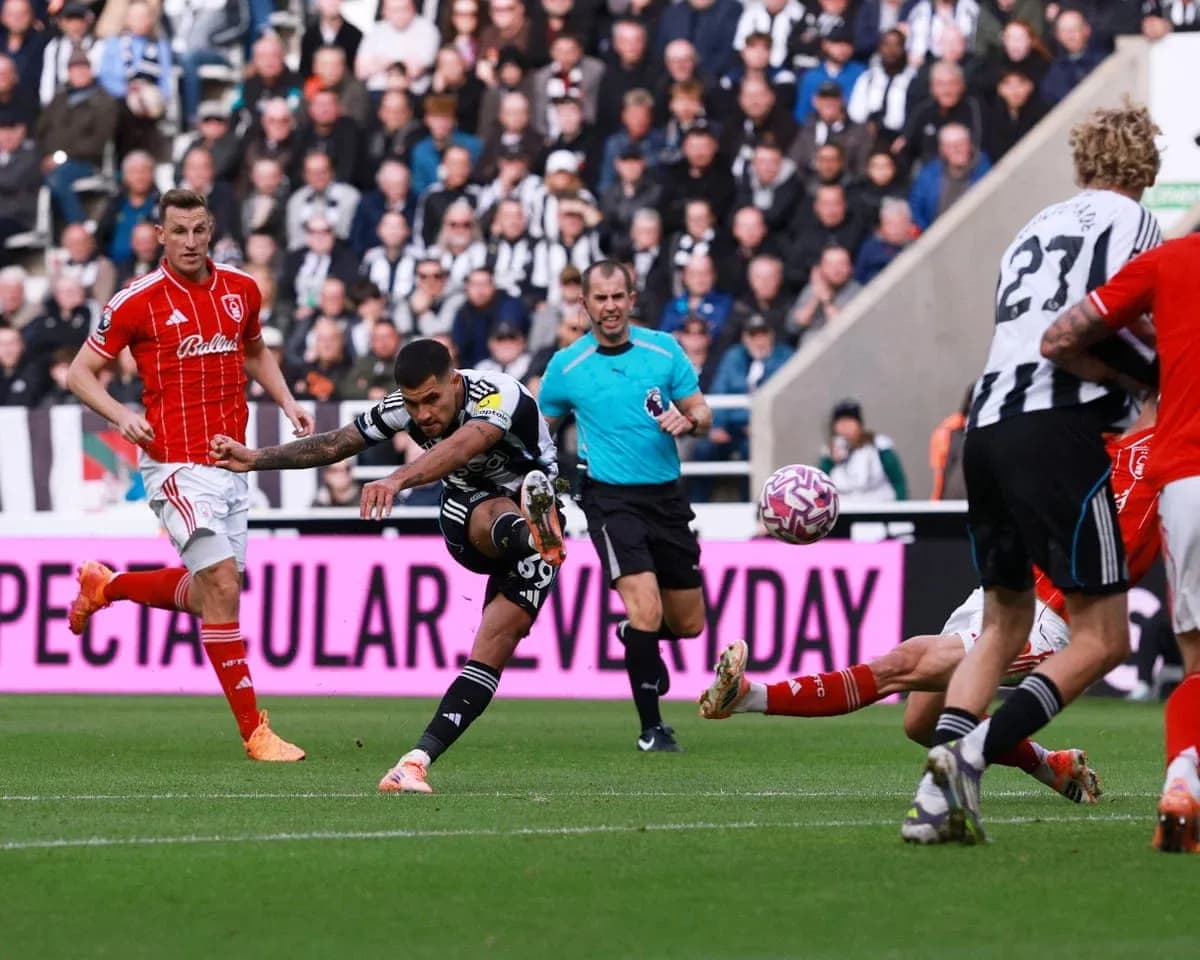 Newcastle player shoots during Nottingham Forest match