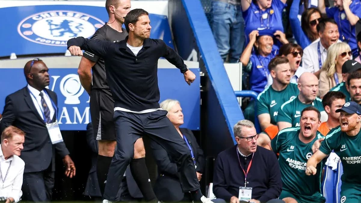 Coach celebrating during match with excited crowd