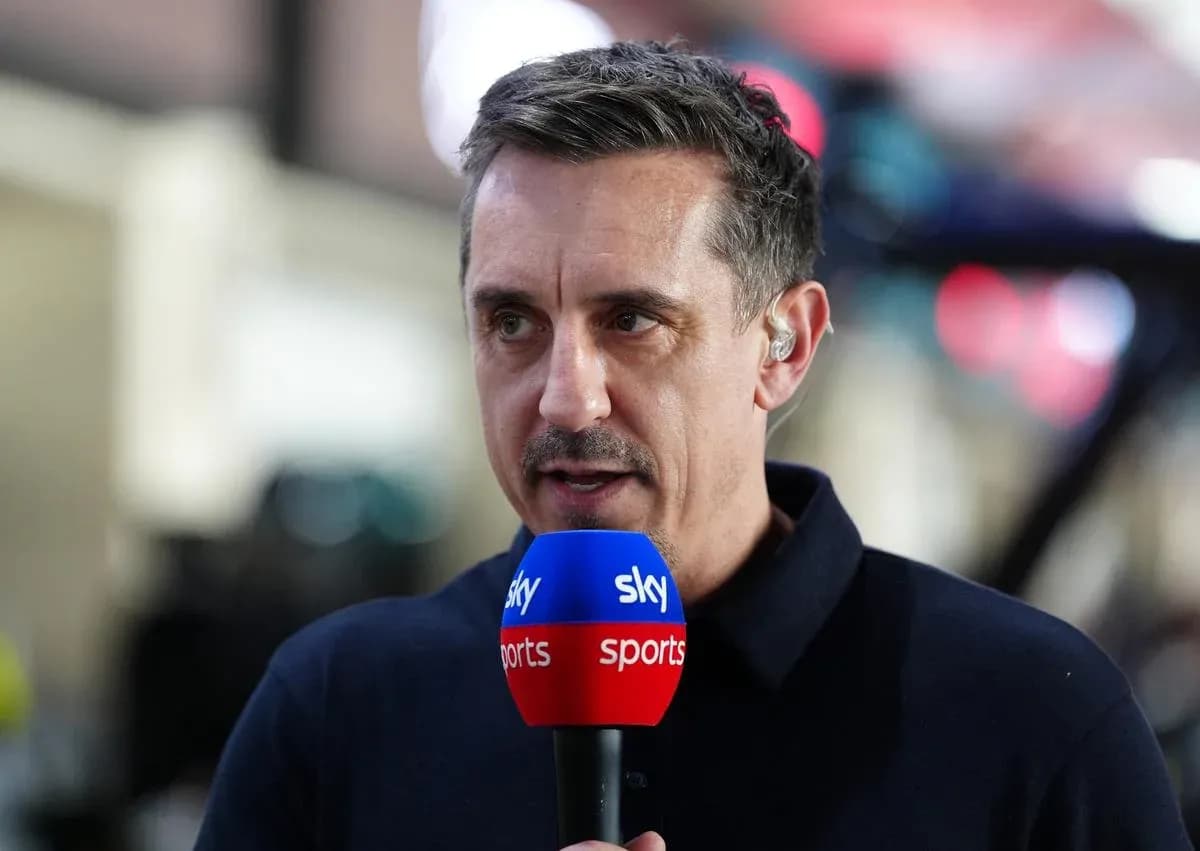 Sports commentator speaking into microphone on set