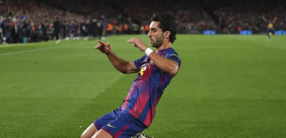 Player celebrating after scoring a goal at Camp Nou