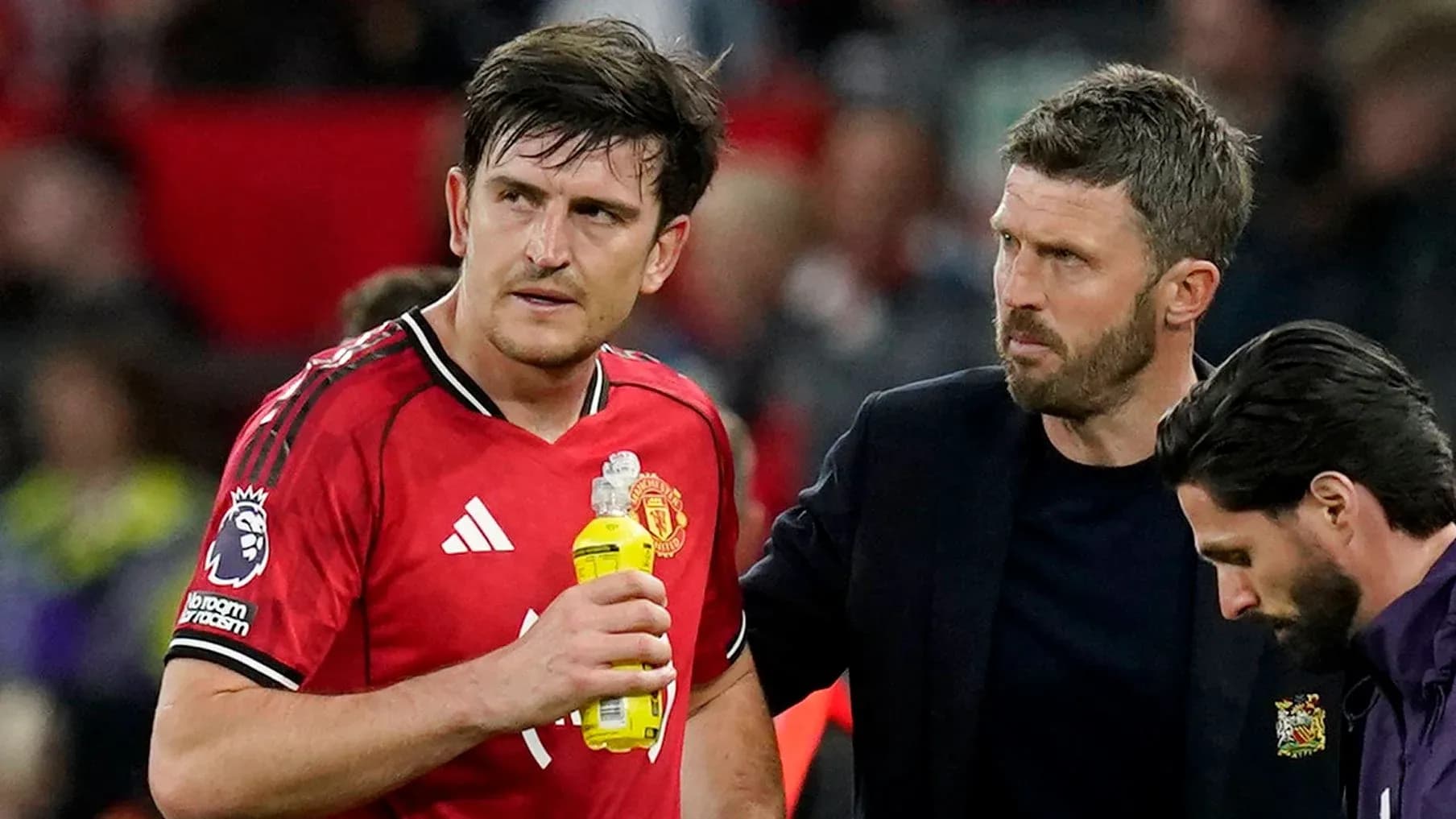 Player receiving assistance from coach after match