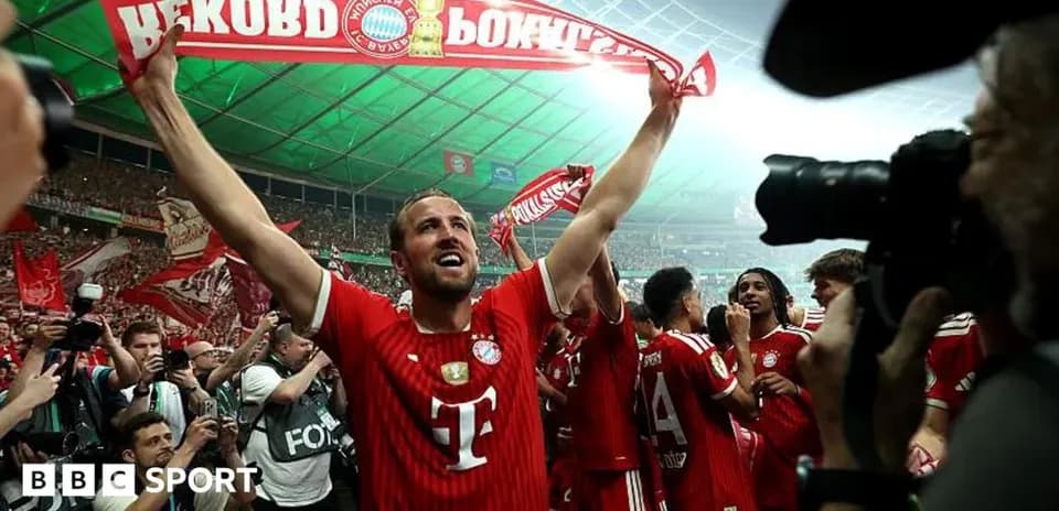 Bayern Munich player celebrating with fans and scarf