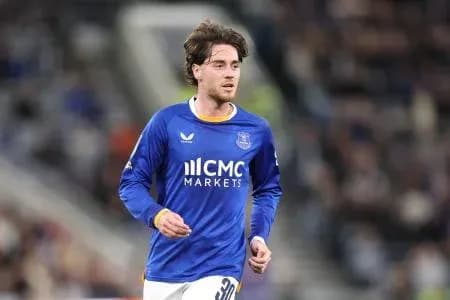 Player running in blue team kit during match