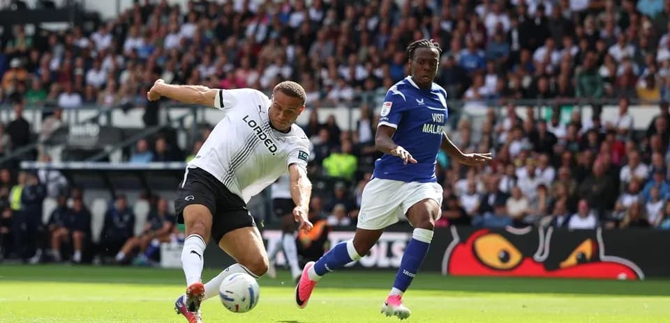 Player kicking ball during match between Derby and Cardiff
