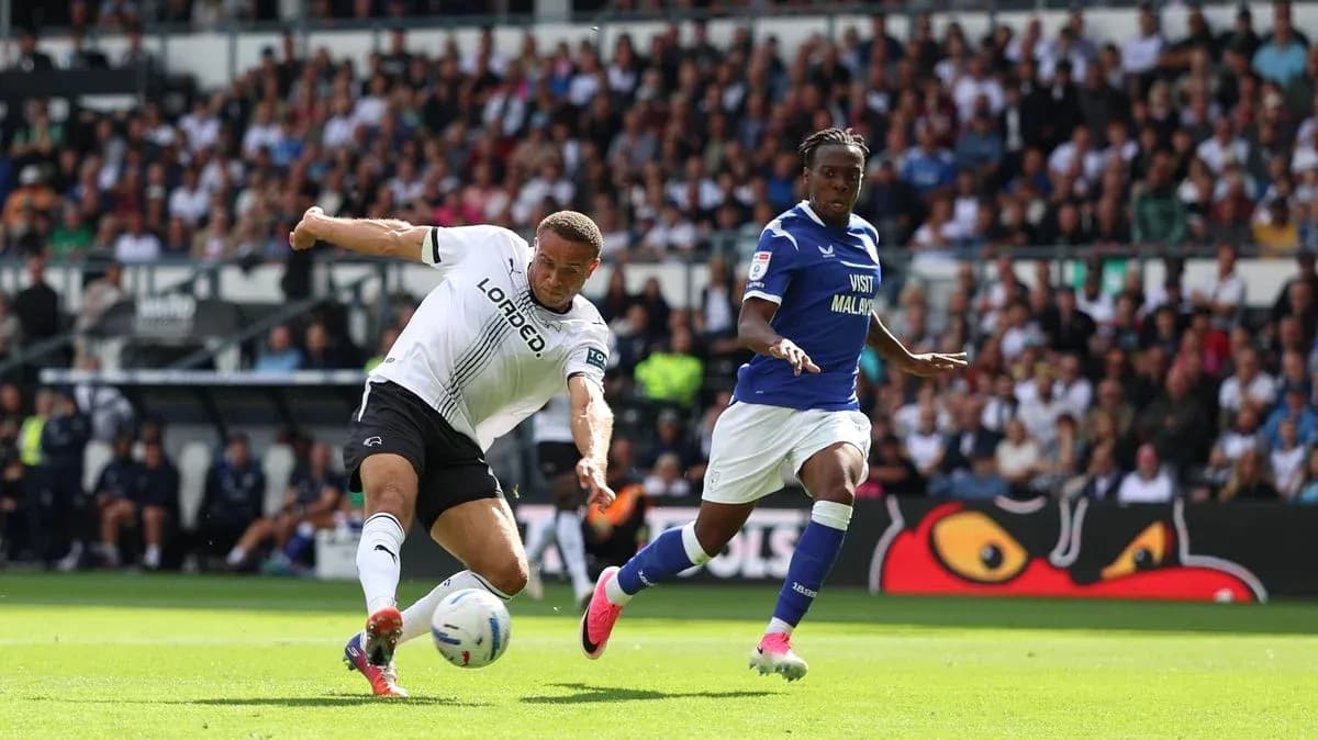 Player kicking ball during match between Derby and Cardiff