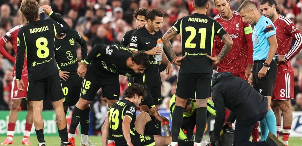 Atletico Madrid players attending to injured teammate
