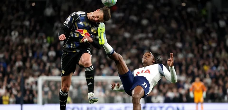 Goalkeeper and player colliding during match action