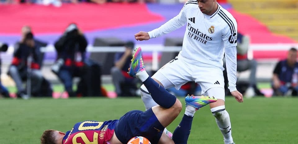 Barcelona player falls during El Clasico match
