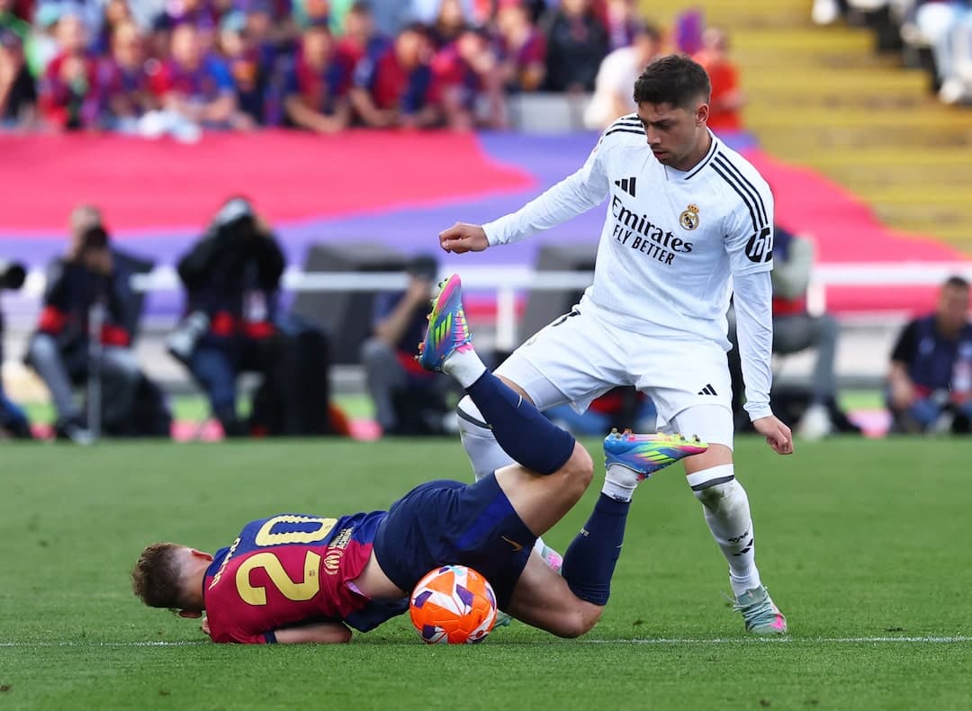 Barcelona player falls during El Clasico match