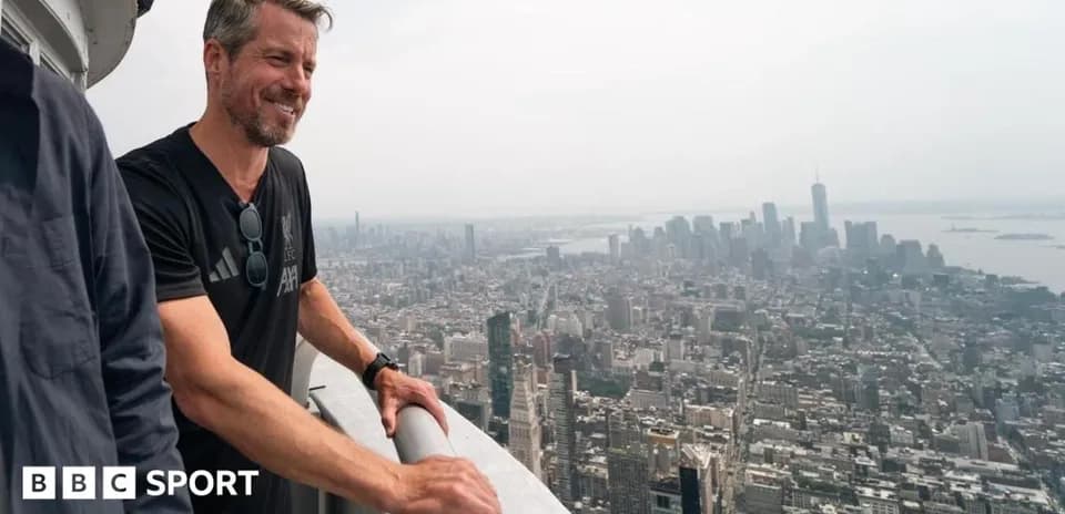 Man overlooking city skyline from high vantage point