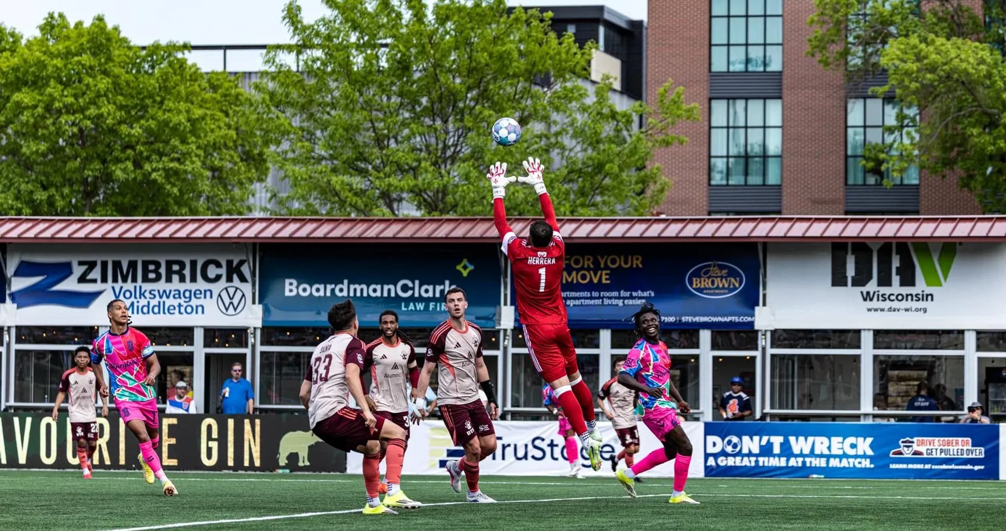 Goalkeeper making a save during Detroit City match