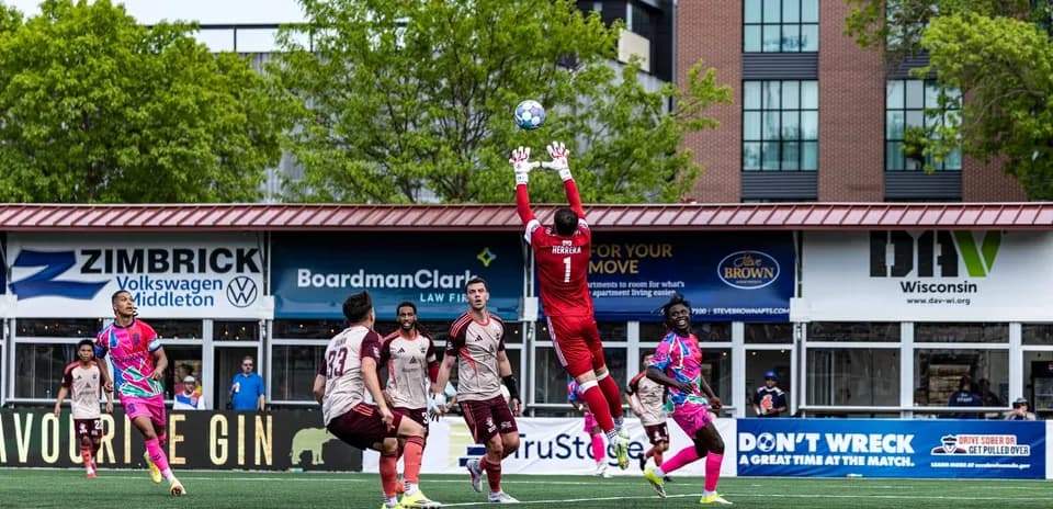 Goalkeeper making a save during Detroit City match