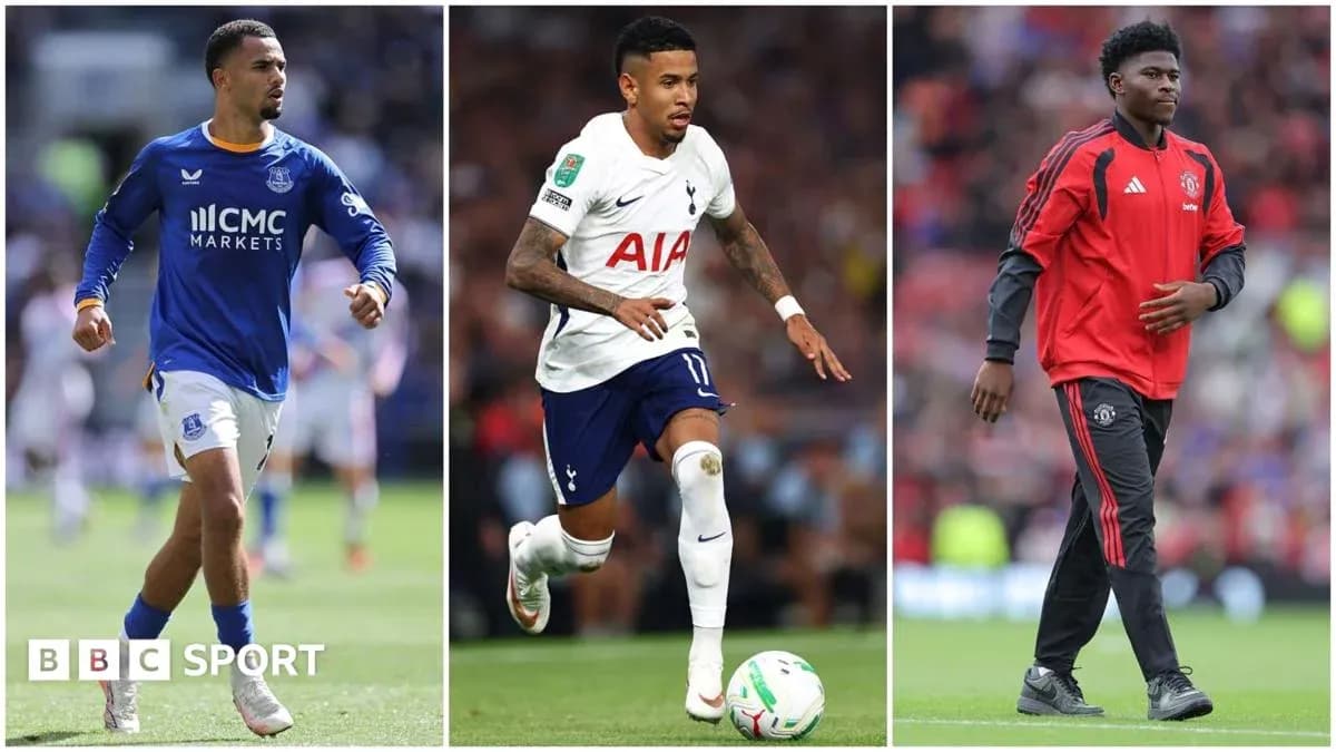 Three football players in club kits on field