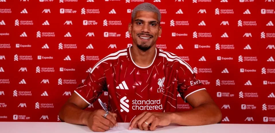 Player signing contract at Liverpool FC announcement