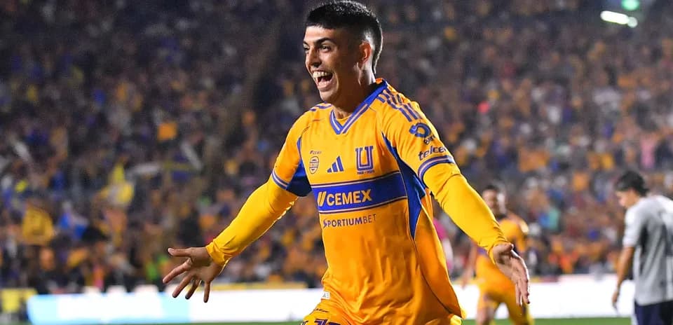 Player celebrating a goal for Tigres UANL