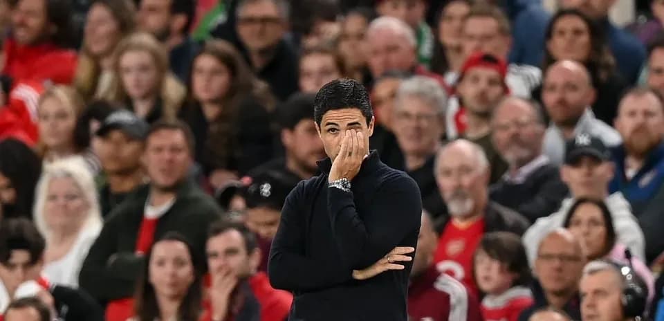 Coach observing the match with concerned expression