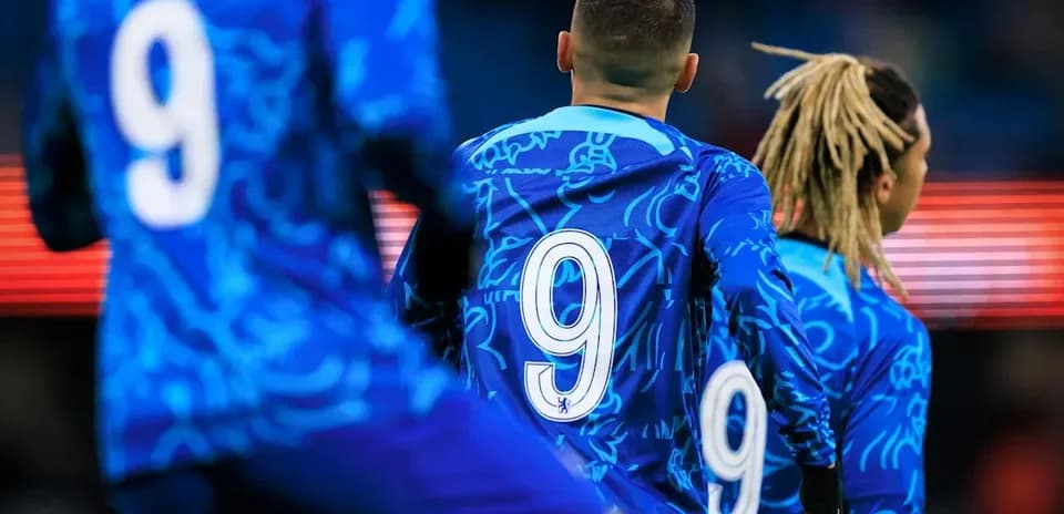 Players in blue jerseys with number 9 visible