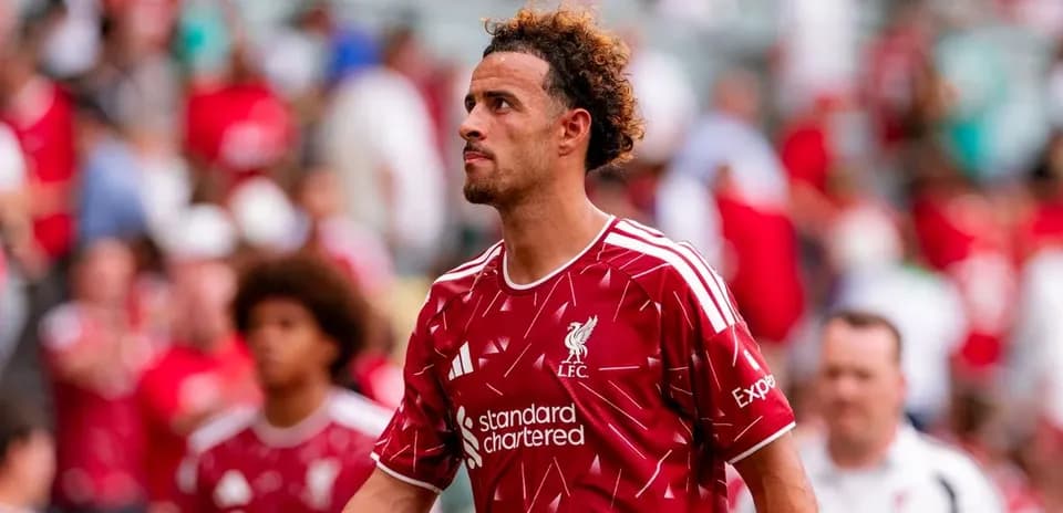 Player walking off field in Liverpool jersey