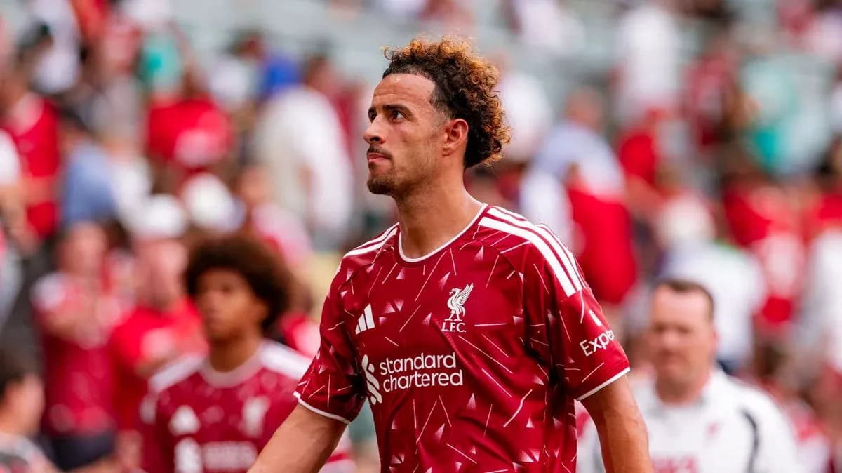 Player walking off field in Liverpool jersey