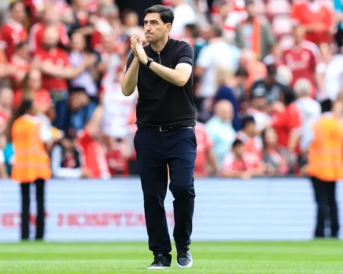 Coach applauding fans after a match