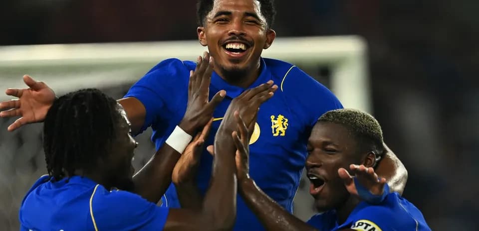 Players celebrating a goal during a match