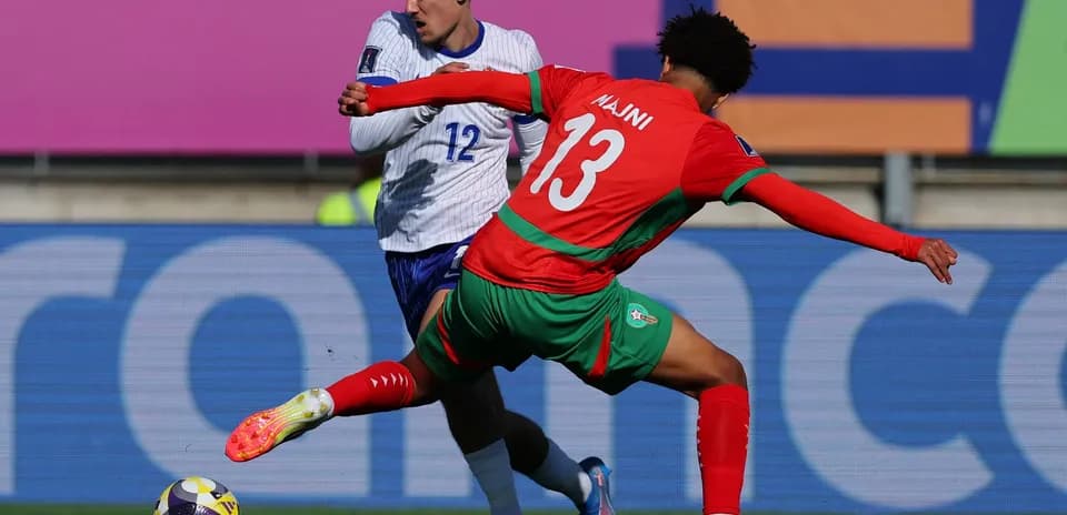 Player tackling opponent during a football match