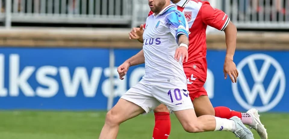 Cavalry FC player dribbling against Pacific FC opponent