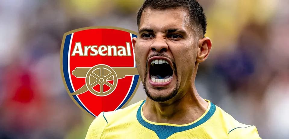 Player celebrating in front of Arsenal logo