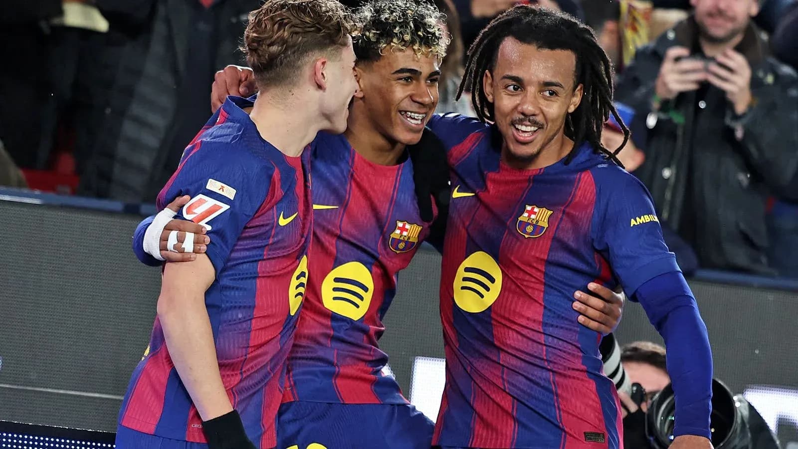 Barcelona players celebrating after scoring a goal