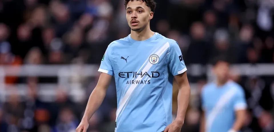 Player in Manchester City kit on the field