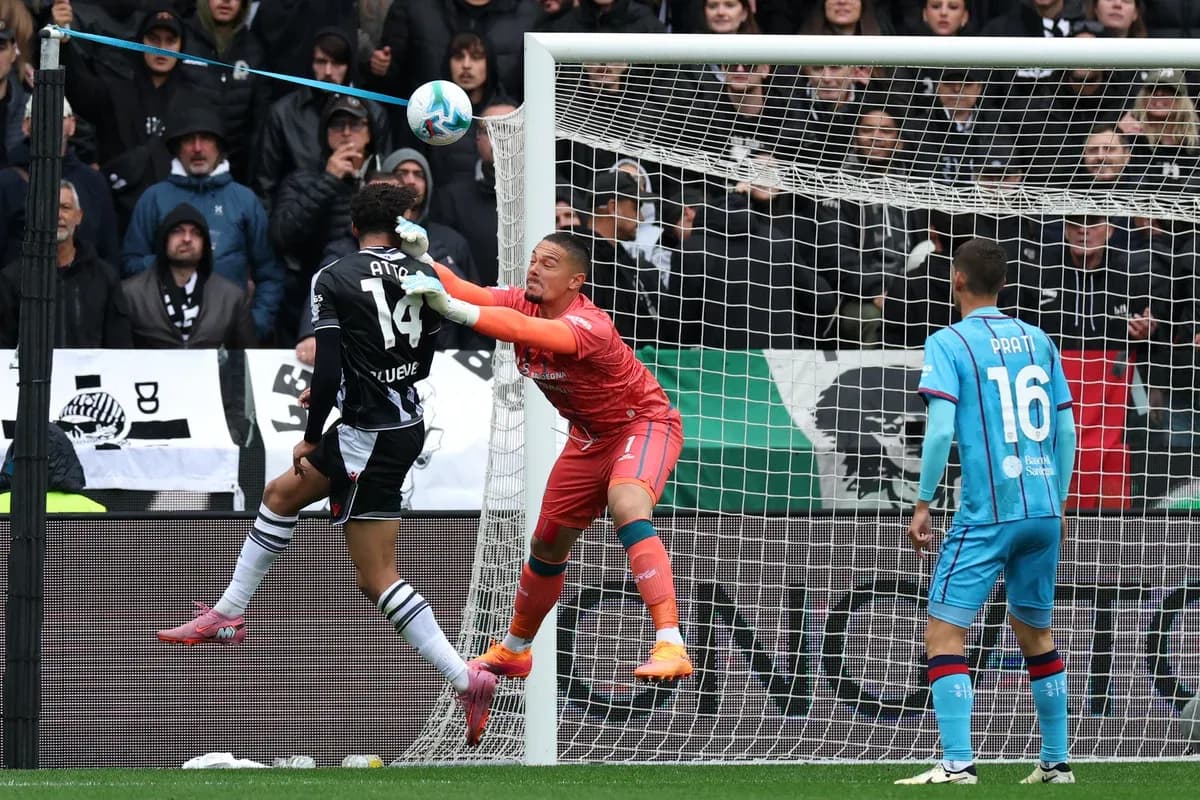 Goalkeeper saves shot during Cagliari vs Udinese match