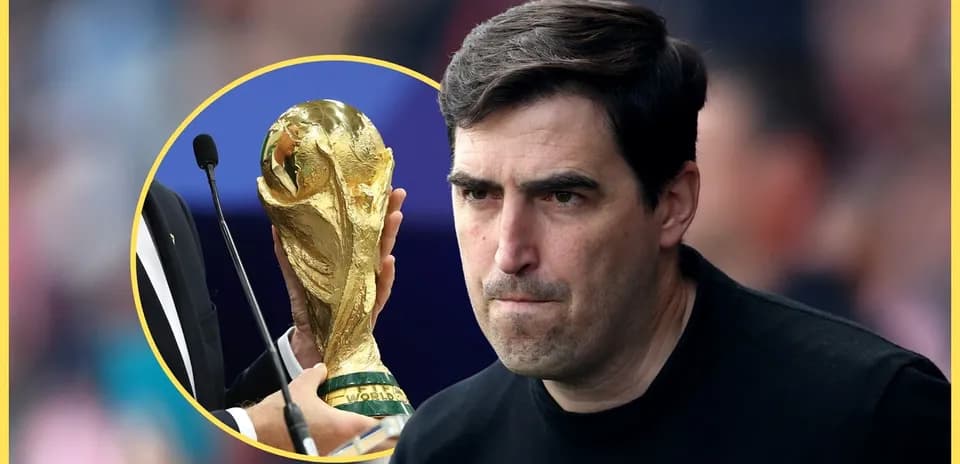 Coach looking serious near World Cup trophy