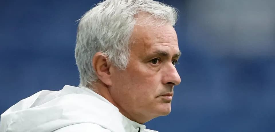 Coach observing during a match on the sidelines