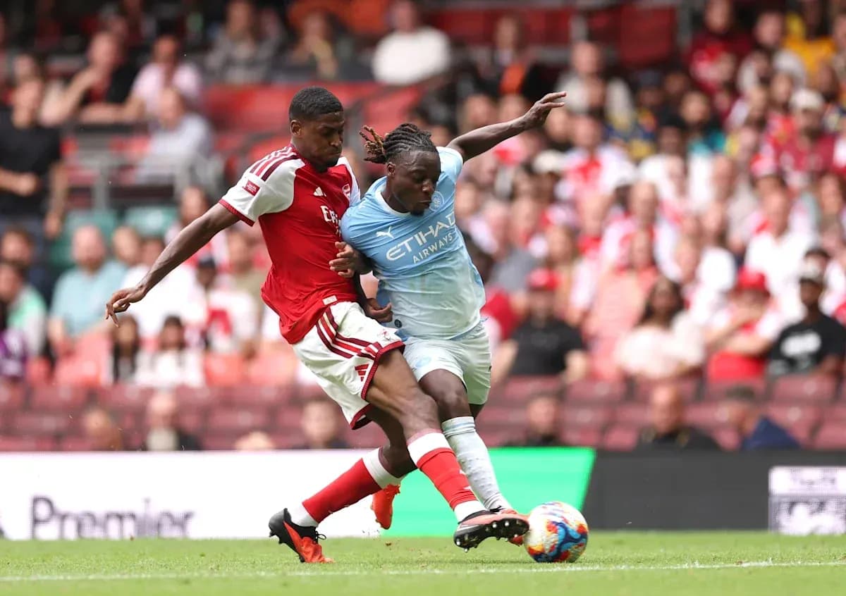 Two players contesting for the ball during match