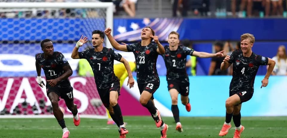 Players celebrating a goal during a match