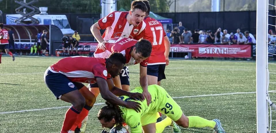 Players contesting during Atlético Ottawa match