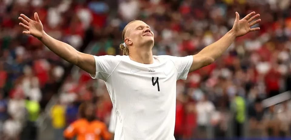 Player celebrating with arms raised during match