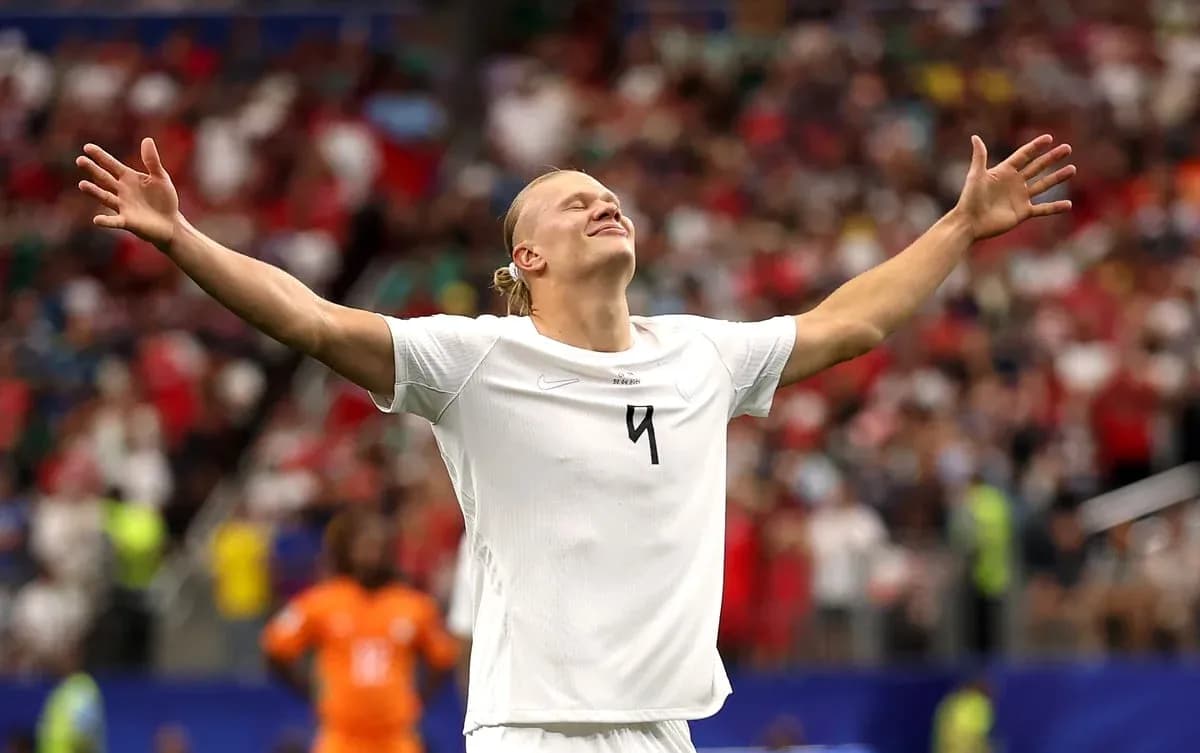 Player celebrating with arms raised during match