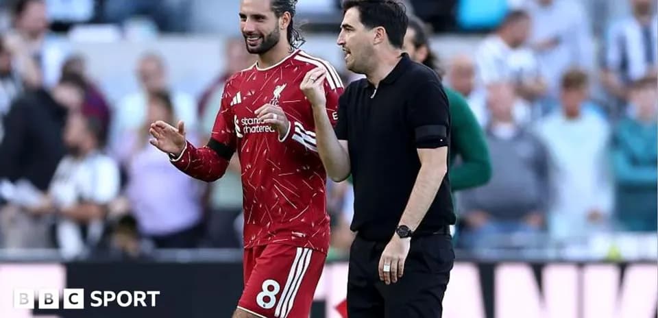 Player and coach discussing during match warm-up