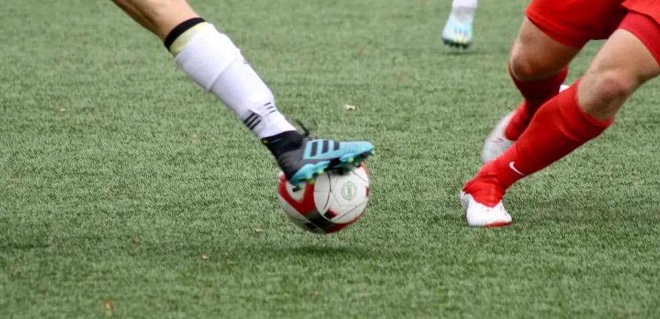 Players competing for the ball during match