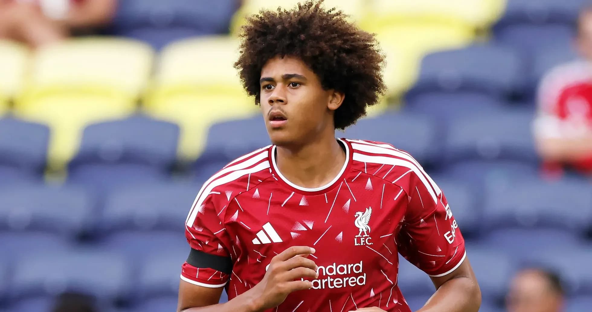 Player in Liverpool kit warming up before match