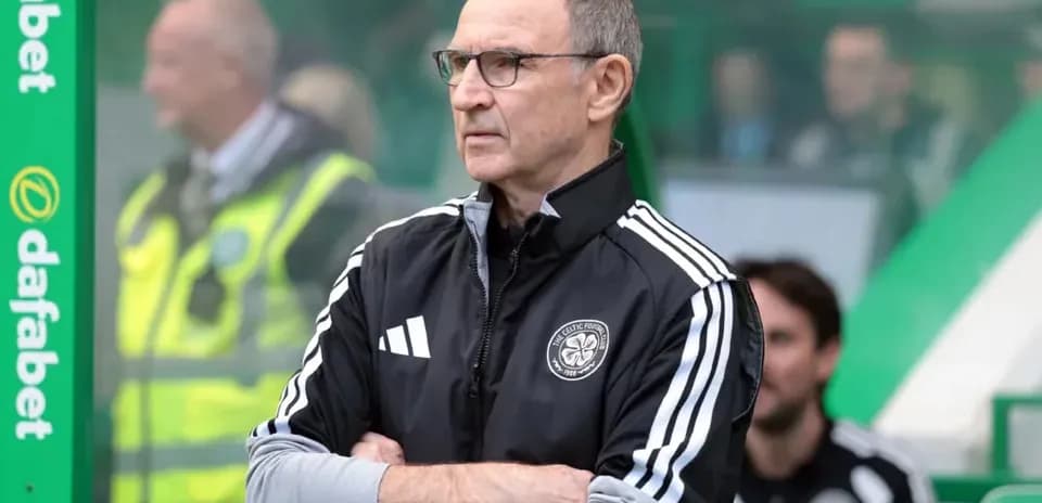 Manager observing match from technical area