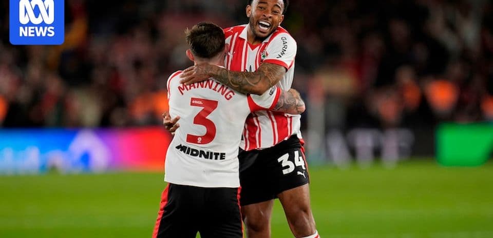 Players celebrating after a match in team jerseys