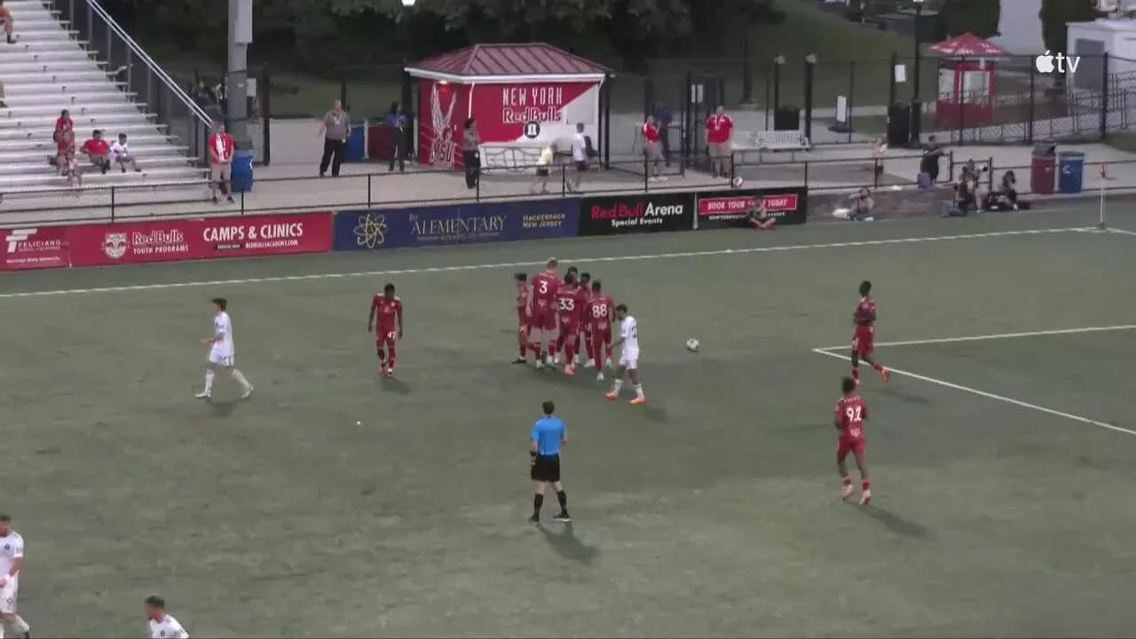 Players preparing for a free kick during match