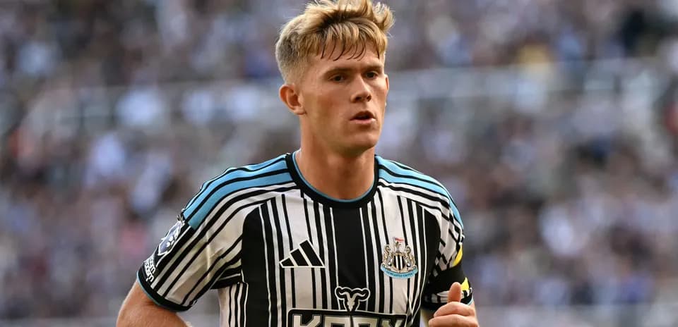 Newcastle player running during a match