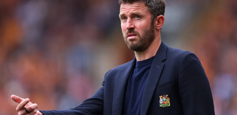 Manager gesturing from the sidelines during match