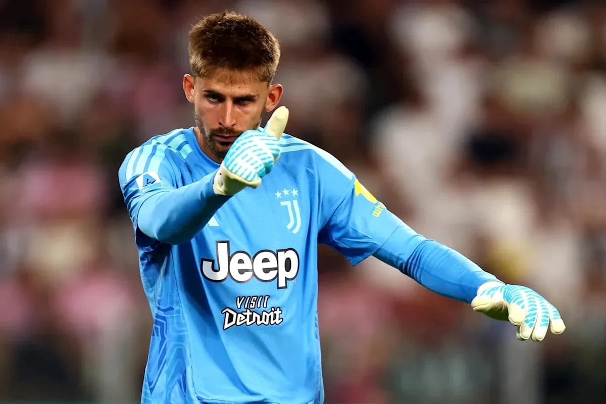 Goalkeeper in blue jersey signaling during match