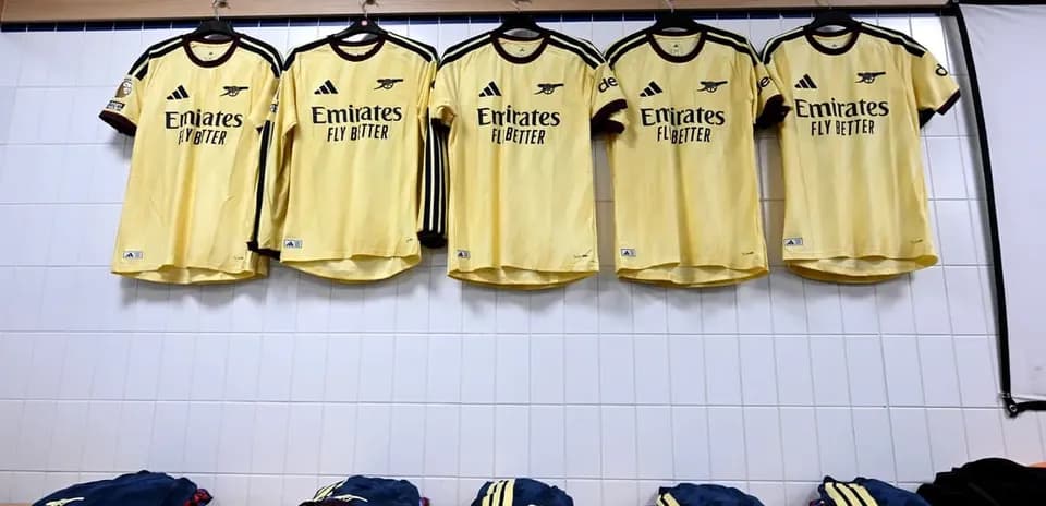 Yellow Arsenal jerseys hanging in locker room